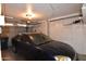 Attached garage featuring a blue car and storage space with automatic door at 5720 E University Dr, Mesa, AZ 85205