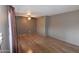 Empty living room featuring laminate floors, ceiling fan, and neutral wall color at 5720 E University Dr, Mesa, AZ 85205