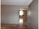 View of the laminate floors and neutral walls of the spacious living room area at 5720 E University Dr, Mesa, AZ 85205