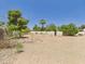 Large backyard with desert landscaping, a chain-link fence, and mature trees, ideal for privacy at 5905 E Donna Ln, Paradise Valley, AZ 85253