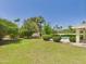 Spacious backyard showcasing lush green lawn, mature landscaping, and backyard pool at 5905 E Donna Ln, Paradise Valley, AZ 85253