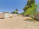 Spacious backyard featuring desert landscaping, mature trees, and block fence perimeter at 5905 E Donna Ln, Paradise Valley, AZ 85253