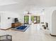 Expansive living room offering ample natural light, tiled floors, and direct access to the outdoor pool area at 5905 E Donna Ln, Paradise Valley, AZ 85253