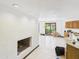 Spacious living area features a cozy fireplace and seamless transition to the bright, open kitchen at 5905 E Donna Ln, Paradise Valley, AZ 85253