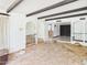 Bright open floor plan with beamed ceilings and arched doorways showcasing natural light and architectural details at 5905 E Donna Ln, Paradise Valley, AZ 85253