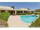 Backyard pool showcasing a clean design, surrounded by well-maintained hedges and landscaping at 5905 E Donna Ln, Paradise Valley, AZ 85253