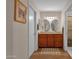 Bathroom with a double vanity, wood cabinets, and a separate shower at 6546 E Dallas St, Mesa, AZ 85205