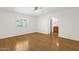 Inviting bedroom with wood floors, ceiling fan and an ensuite bathroom in view at 6546 E Dallas St, Mesa, AZ 85205