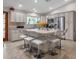Modern kitchen with an island, stainless steel appliances, stone countertops, and lots of cabinets at 6546 E Dallas St, Mesa, AZ 85205