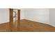 Spacious living room with wood floors, sliding barn door, and views to the dining room at 6546 E Dallas St, Mesa, AZ 85205