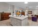 Open-concept kitchen and living area with an island and dining space at 6546 E Dallas St, Mesa, AZ 85205