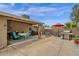 Spacious outdoor patio featuring a dining area, comfortable seating, and a BBQ grill at 6546 E Dallas St, Mesa, AZ 85205