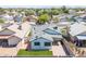 Picturesque aerial view of a private residence boasting a well-manicured lawn and charming desert landscape at 6938 W Nicolet Ave, Glendale, AZ 85303
