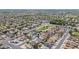 Extensive aerial view of a residential community, displaying a park amidst homes with well-kept lawns at 6938 W Nicolet Ave, Glendale, AZ 85303