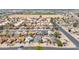 An aerial view showcasing the neighborhood with well-maintained landscaping, surrounding residences and open spaces at 6938 W Nicolet Ave, Glendale, AZ 85303