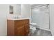 Bathroom featuring a vanity with cabinets, toilet, and a shower with glass doors at 6938 W Nicolet Ave, Glendale, AZ 85303