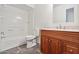 Bathroom featuring a tiled shower/tub, a toilet, and a vanity with drawers at 6938 W Nicolet Ave, Glendale, AZ 85303