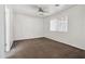 Bright bedroom with neutral carpet, ceiling fan, and natural light from the window at 6938 W Nicolet Ave, Glendale, AZ 85303