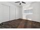 Bedroom with neutral carpet, ceiling fan, a window, and closet at 6938 W Nicolet Ave, Glendale, AZ 85303