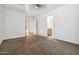 Bright bedroom with neutral carpet and view of bathroom at 6938 W Nicolet Ave, Glendale, AZ 85303