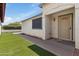 Inviting home entrance with artificial grass and a secure screen door entrance at 6938 W Nicolet Ave, Glendale, AZ 85303
