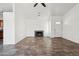 Bright living room featuring neutral tile floors and a fireplace at 6938 W Nicolet Ave, Glendale, AZ 85303