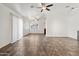 Bright living space with neutral tile floors, ceiling fan, and lots of natural light from the windows at 6938 W Nicolet Ave, Glendale, AZ 85303