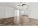 Bright living space with neutral tile floors, ceiling fan, and lots of natural light from the windows at 6938 W Nicolet Ave, Glendale, AZ 85303