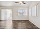 Bright living space featuring neutral tile floors, large windows, and sliding door at 6938 W Nicolet Ave, Glendale, AZ 85303