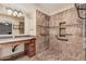 Accessible bathroom with zero-entry shower, grab bars, and a spacious vanity at 7426 W Cholla St, Peoria, AZ 85345