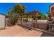 Backyard hot tub and pergola with privacy fence, offering a relaxing retreat in a private outdoor space at 7426 W Cholla St, Peoria, AZ 85345