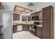 Functional kitchen with tile flooring, ample cabinet space, and modern appliances at 7426 W Cholla St, Peoria, AZ 85345
