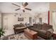 Comfortable living room featuring a ceiling fan, ample seating, and stylish decor at 7426 W Cholla St, Peoria, AZ 85345