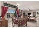 Inviting living space with a large window, dining area and natural light at 7426 W Cholla St, Peoria, AZ 85345