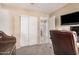 Home office featuring sliding closet doors, carpet floors, and plenty of room to move around at 7426 W Cholla St, Peoria, AZ 85345