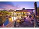 Backyard features pool, patio, seating, and desert landscaping at 7846 E Wilderness Trl, Gold Canyon, AZ 85118