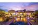 Expansive backyard with pool, patio, and desert landscaping, perfect for outdoor entertaining at 7846 E Wilderness Trl, Gold Canyon, AZ 85118