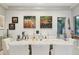 Bright dining room with textured walls, artwork, and seating for eight, perfect for Gathering dinners and entertaining at 7846 E Wilderness Trl, Gold Canyon, AZ 85118