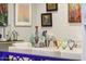 Close-up of dining room decorations with sheep sculptures, colorful hearts, and artwork, adding personality to the space at 7846 E Wilderness Trl, Gold Canyon, AZ 85118