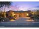 Charming home exterior with desert landscaping, a three-car garage, and inviting curb appeal at 7846 E Wilderness Trl, Gold Canyon, AZ 85118