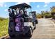 Close up of golf cart loaded with golf bags on a paved path at 7846 E Wilderness Trl, Gold Canyon, AZ 85118