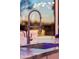 Close up of a kitchen faucet featuring marble counter tops at 7846 E Wilderness Trl, Gold Canyon, AZ 85118