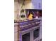 Close up of gourmet stainless steel range with oven and marble backsplash at 7846 E Wilderness Trl, Gold Canyon, AZ 85118