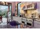 Close up of modern kitchen featuring stainless steel appliances, marble counter tops and mountain views at 7846 E Wilderness Trl, Gold Canyon, AZ 85118