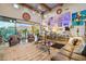 Bright living room with a large sliding glass door, travertine flooring, tall ceilings, and open concept floorplan at 7846 E Wilderness Trl, Gold Canyon, AZ 85118