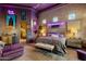 Spacious main bedroom with a brick accent wall and neon sign, offering a unique and cozy atmosphere at 7846 E Wilderness Trl, Gold Canyon, AZ 85118