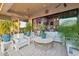 Beautifully appointed outdoor living space with comfortable seating and seamless transition to the indoors at 7846 E Wilderness Trl, Gold Canyon, AZ 85118