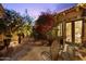 Tranquil patio with lush foliage, comfortable seating, and a peaceful ambiance at 7846 E Wilderness Trl, Gold Canyon, AZ 85118