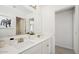 Modern bathroom with double sinks, white countertops, and a contemporary design at 8030 W Griswold Rd, Peoria, AZ 85345