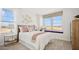 Bright bedroom features a large window, neutral tones, and stylish furnishings at 8030 W Griswold Rd, Peoria, AZ 85345